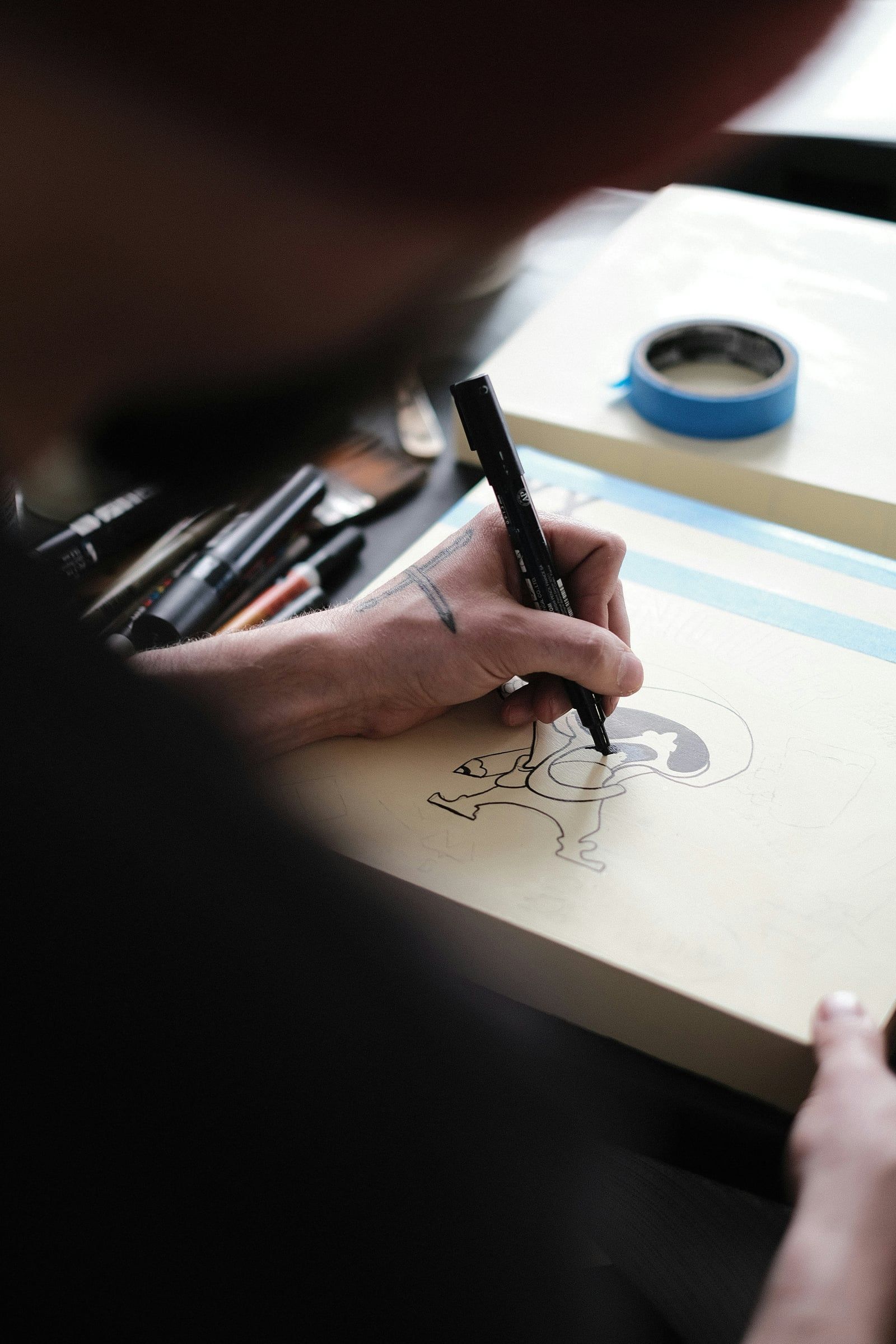 Illustrator drawing by hand with a fine pen